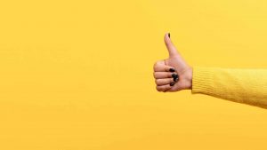 thumbs up on yellow background