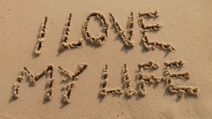 i love my life written in the sand