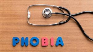 a stethoscope above the word phobia