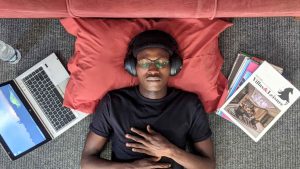 a person lay down with headphones on